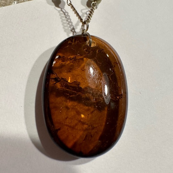 Beautiful amber stone hangs from chain with delicate clusters of small beads. - Picture 9 of 13